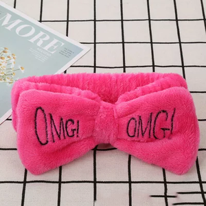 Hot Pink OMG headband. keeps your edges in place while washing your face or doing makeup